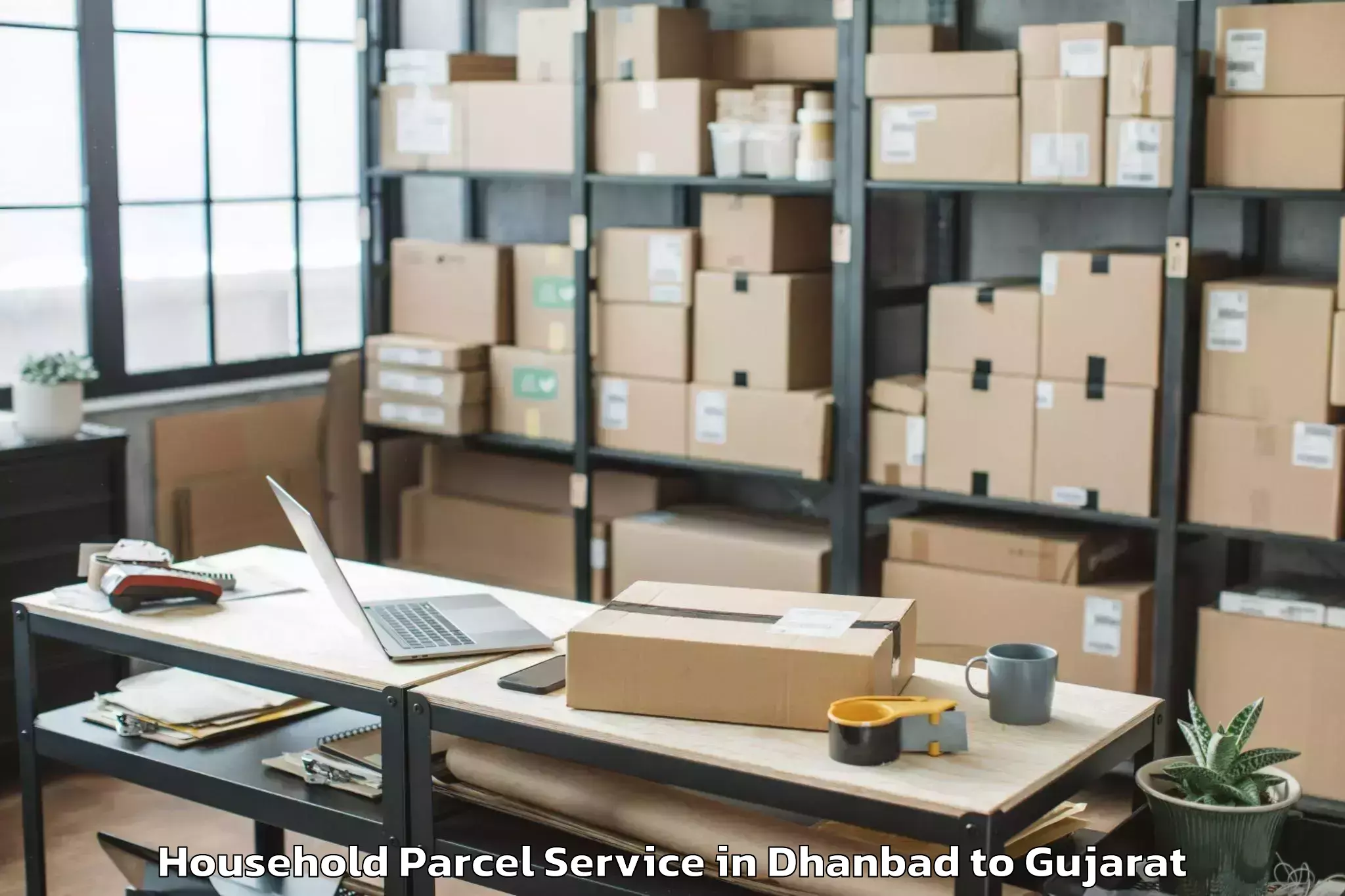 Top Dhanbad to Kodinar Household Parcel Available